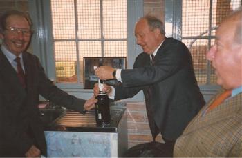 John Harding opening bottle with Tommy Henderson